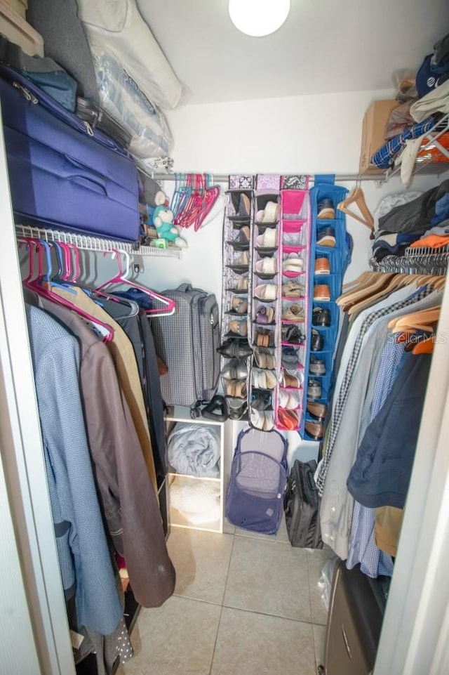 walk in closet featuring tile patterned flooring