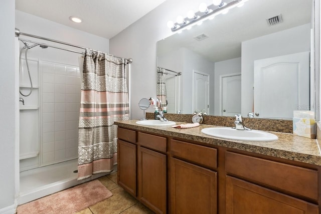 bathroom with tile patterned flooring, vanity, and a shower with shower curtain