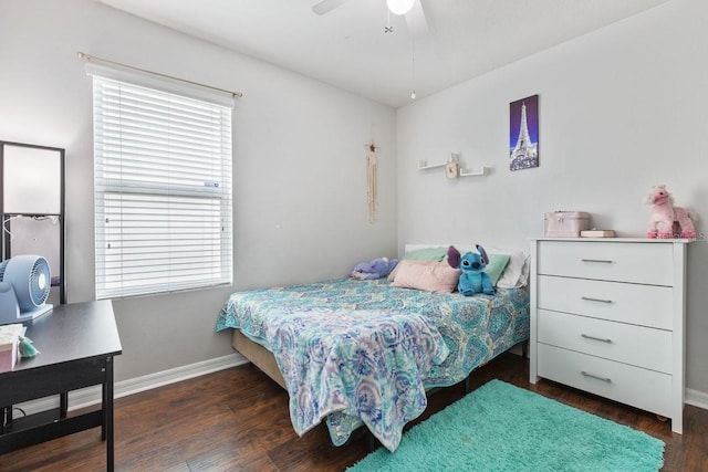 bedroom with ceiling fan and dark hardwood / wood-style flooring