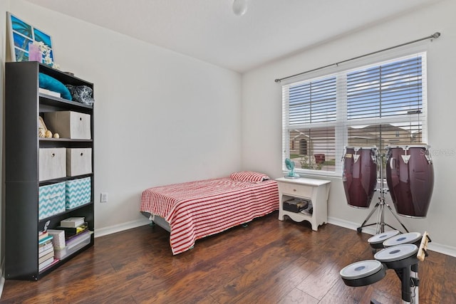 bedroom with dark wood-type flooring