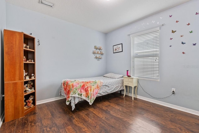 bedroom featuring dark wood-type flooring