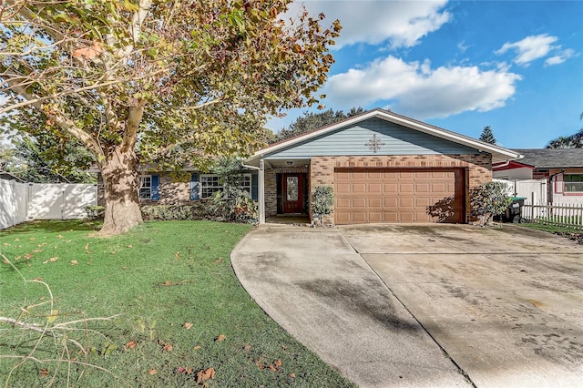 ranch-style house with a garage and a front yard