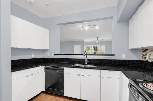 kitchen with white cabinetry, dishwasher, ceiling fan, sink, and dark stone counters