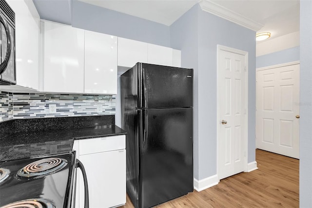 kitchen featuring black appliances, white cabinets, decorative backsplash, ornamental molding, and light hardwood / wood-style floors