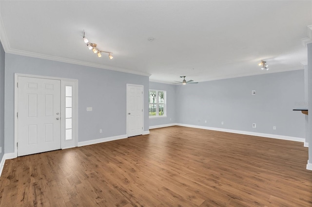 interior space featuring ceiling fan, wood-type flooring, and crown molding