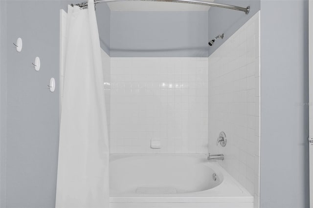 bathroom featuring shower / tub combo with curtain