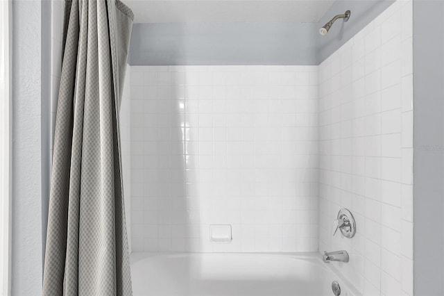 details with shower / bath combination with curtain