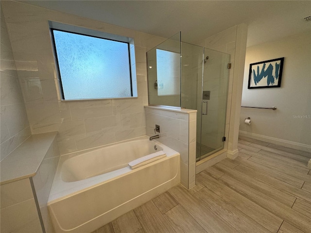 bathroom featuring plus walk in shower