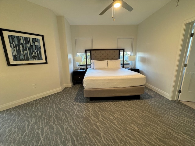 unfurnished bedroom with dark carpet and ceiling fan