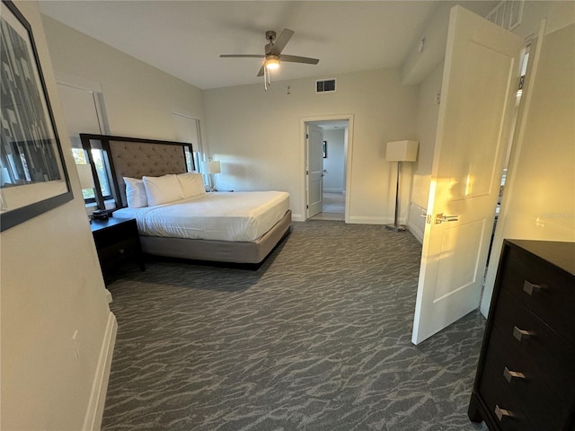 bedroom featuring ceiling fan and dark colored carpet