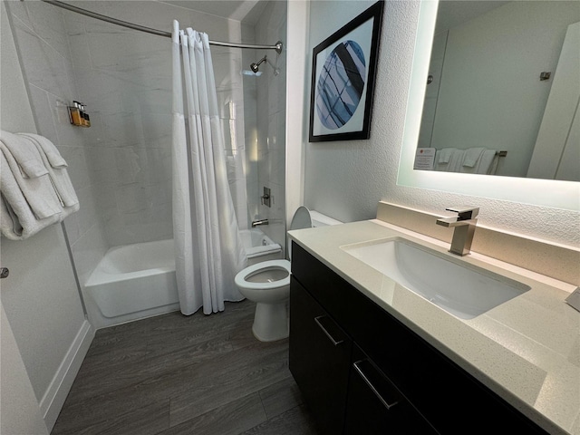 full bathroom with shower / tub combo with curtain, vanity, wood-type flooring, and toilet