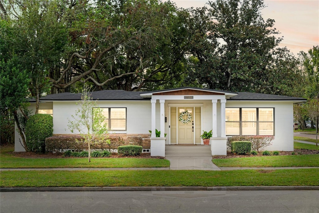 view of front of home with a lawn