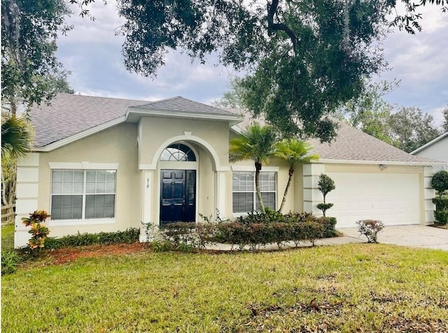 ranch-style home with a front lawn and a garage