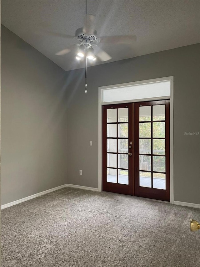 additional living space with carpet flooring, ceiling fan, a textured ceiling, and french doors