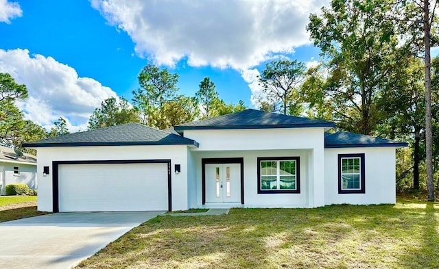 view of front of house featuring a front lawn and a garage