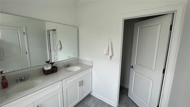 bathroom with tile patterned flooring and vanity