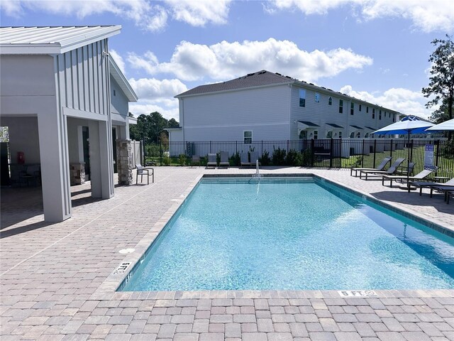 view of pool featuring a patio area