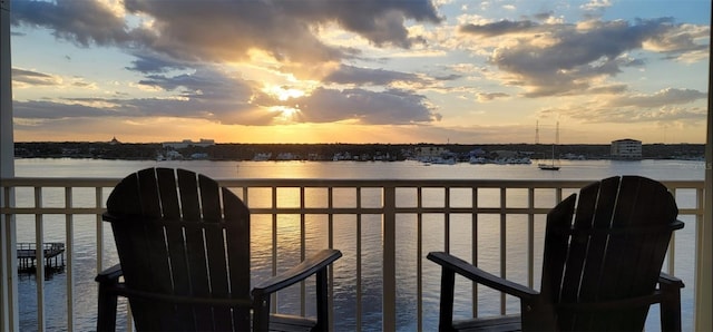 balcony at dusk with a water view