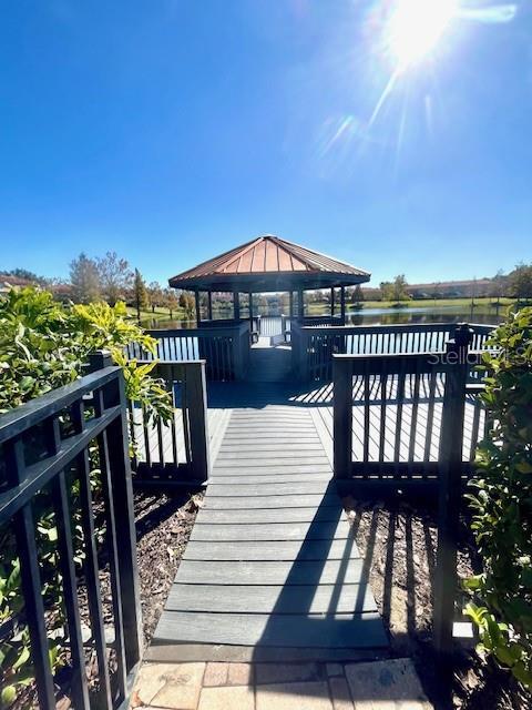 dock area featuring a gazebo and a water view