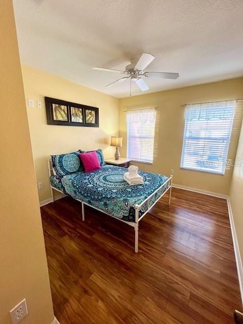 bedroom featuring hardwood / wood-style floors and ceiling fan