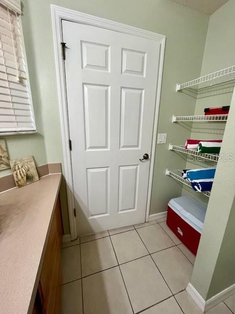 bathroom with tile patterned floors