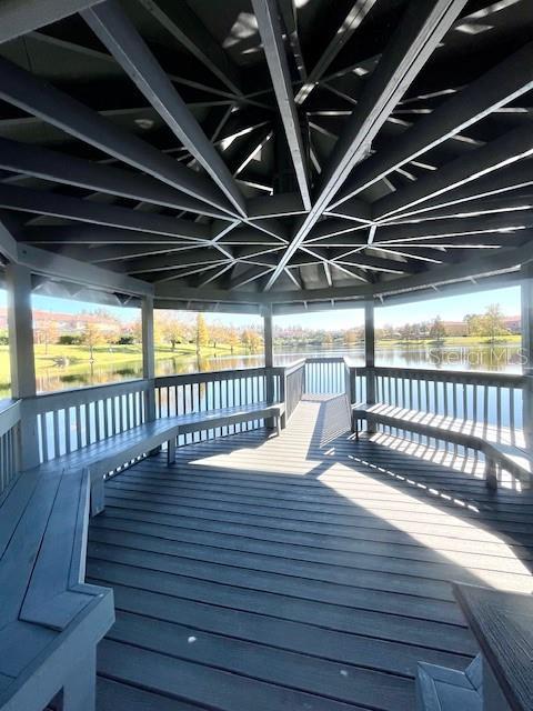 wooden deck with a water view