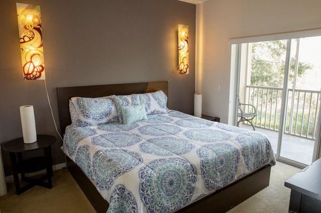 bedroom featuring access to exterior and light colored carpet