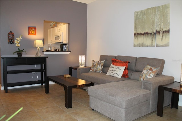 living room with tile patterned flooring