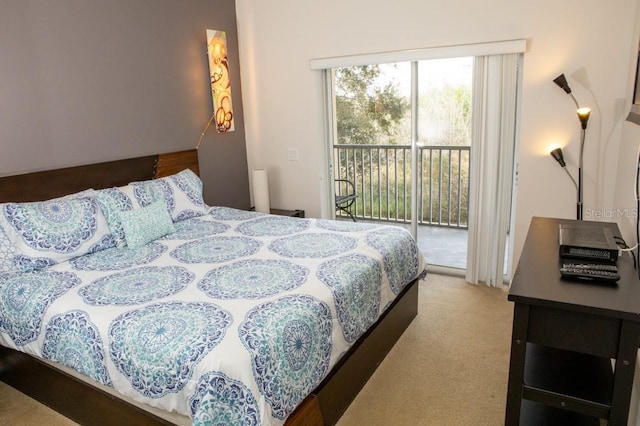 carpeted bedroom featuring access to outside