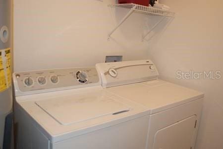 washroom with washer and clothes dryer