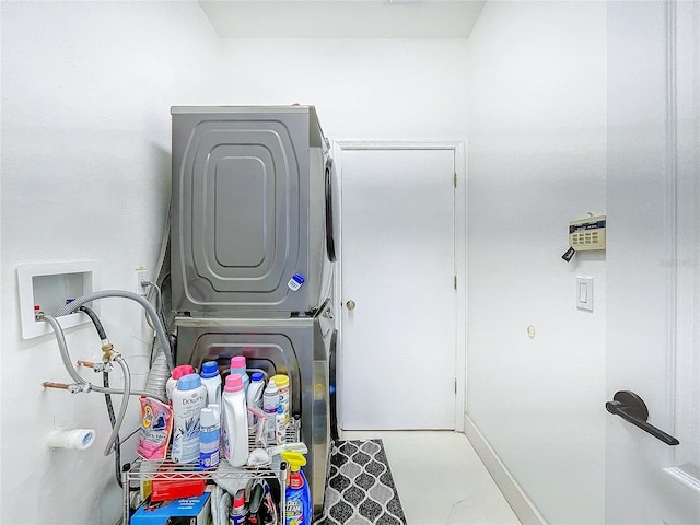 laundry room with stacked washer and clothes dryer