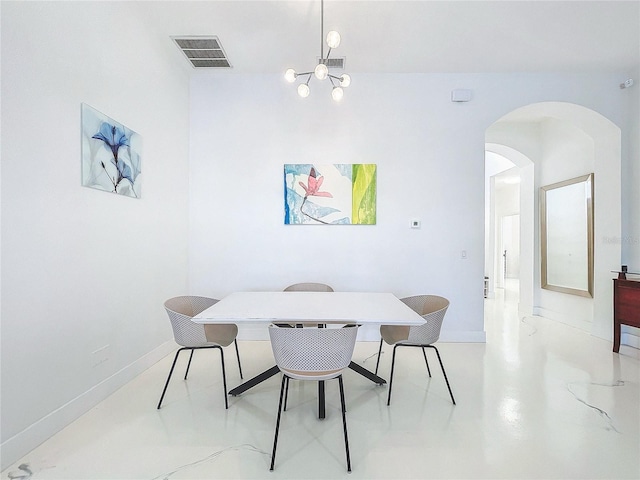 dining space featuring a notable chandelier