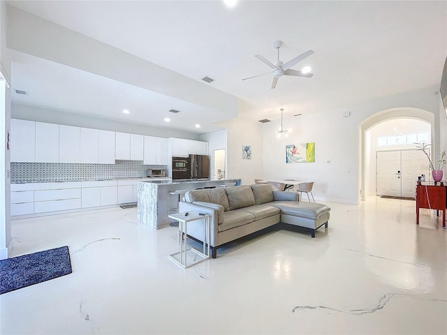 living room with ceiling fan