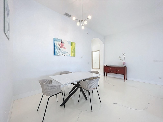 dining space featuring an inviting chandelier