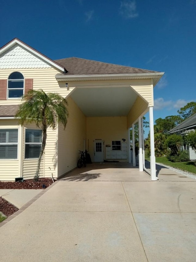 exterior space featuring a carport