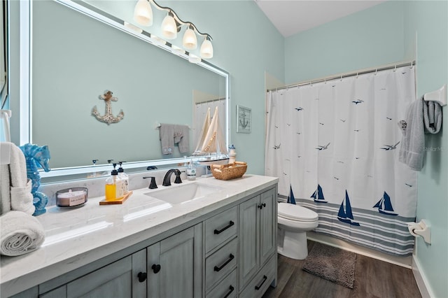 bathroom with hardwood / wood-style flooring, vanity, and toilet