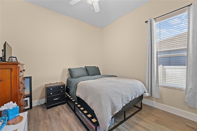 bedroom with light wood-type flooring and ceiling fan