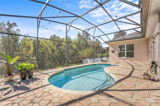 view of pool featuring a lanai and a patio