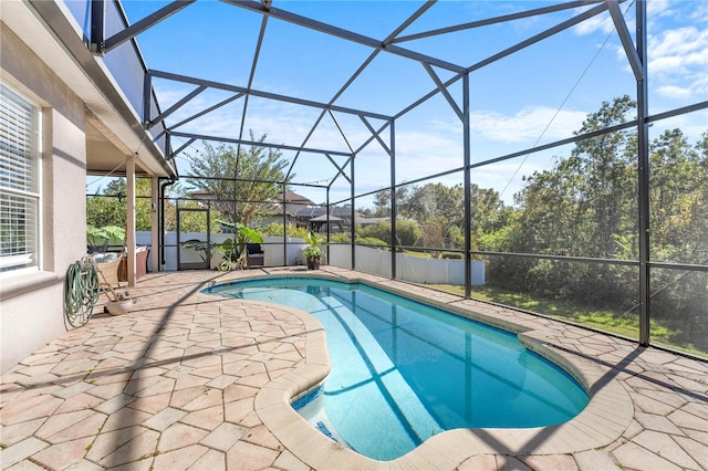 view of swimming pool with a lanai, a jacuzzi, and a patio