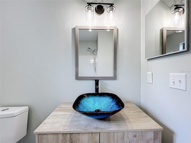 bathroom featuring sink and toilet