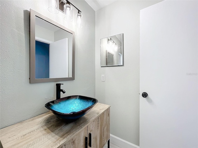 bathroom with hardwood / wood-style flooring and vanity