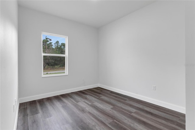 unfurnished room featuring dark hardwood / wood-style floors