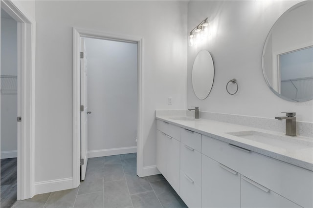 bathroom featuring vanity and tile patterned flooring