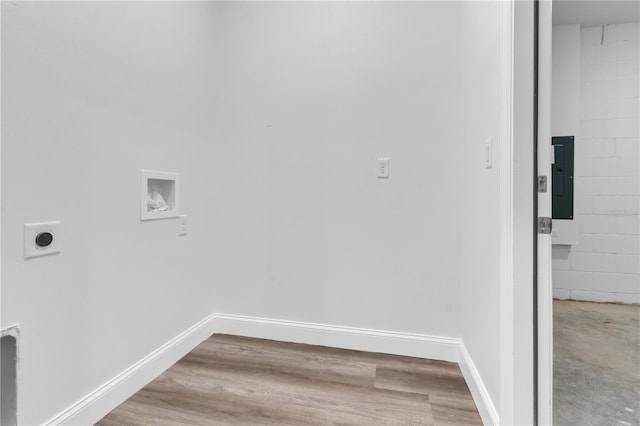 laundry area featuring washer hookup, electric panel, hardwood / wood-style floors, and electric dryer hookup