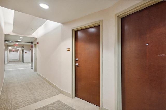 hallway with light carpet