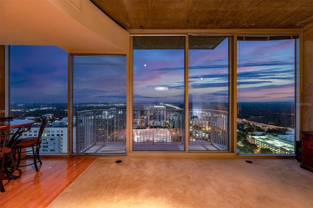 interior space featuring hardwood / wood-style flooring and wood ceiling