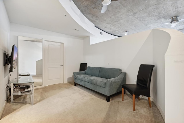 sitting room with carpet flooring and ceiling fan