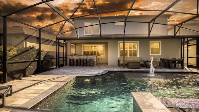 rear view of house featuring outdoor lounge area, a patio area, and pool water feature