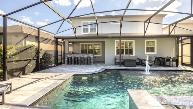 rear view of property featuring outdoor lounge area, a lanai, a patio area, and exterior bar