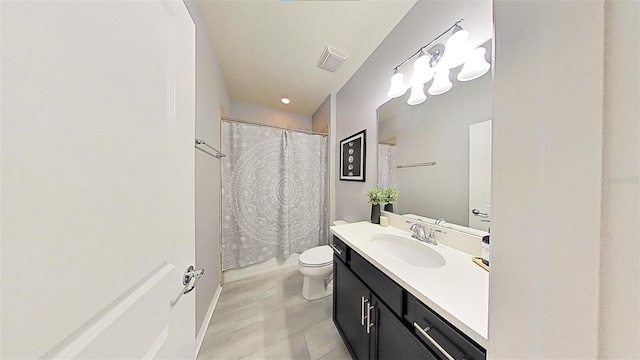 bathroom with tile patterned floors, vanity, and toilet